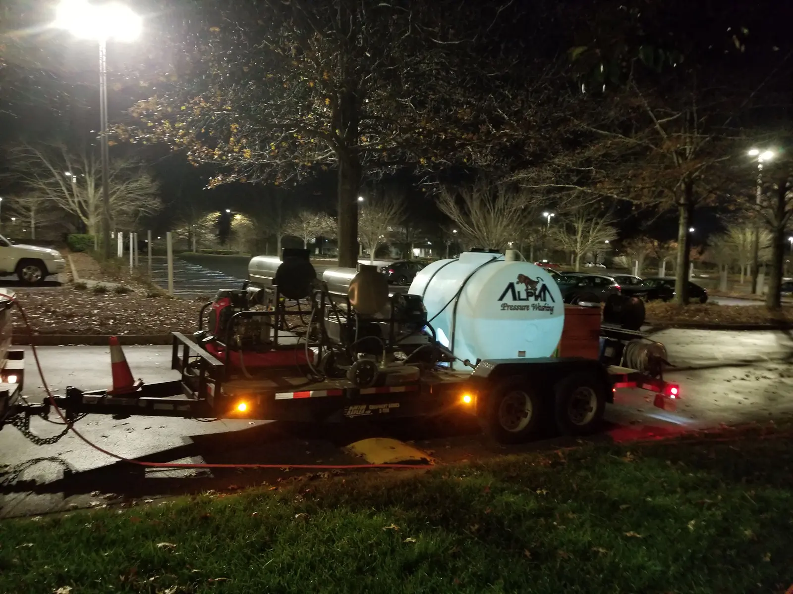 Night commercial pressure-washing job, rig on a flatbed, Townpark Drive Northwest, Townpark Ravine One, Cobb County, GA (Dec 2018)
