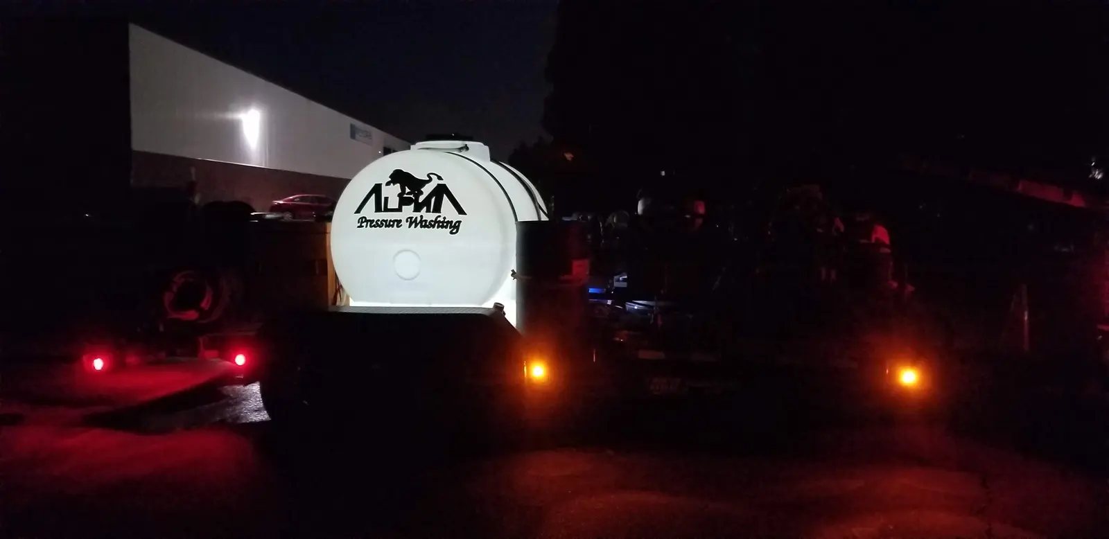 Night commercial pressure-washing job, flatbed with wash tanks, McCollum Parkway Northwest, Kennesaw, GA (Aug 2018)