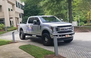 Marietta Pressure Washing Pickup Truck parked on a driveway in front of a condo