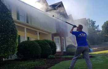 employee marietta pressure washing at work