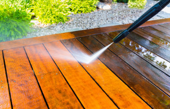cleaning the terrace with a pressure washer